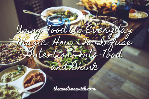 Using Food As Everyday Magic: How To Infuse Intention Into Food and Drink Blog post title with a table covered with delicious looking foods